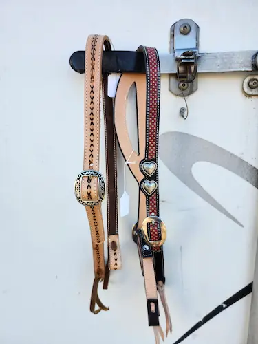 Handtooled leather bridles with silver buckles